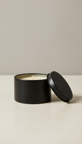 Saffron and sparkling wine candle in a silver tin